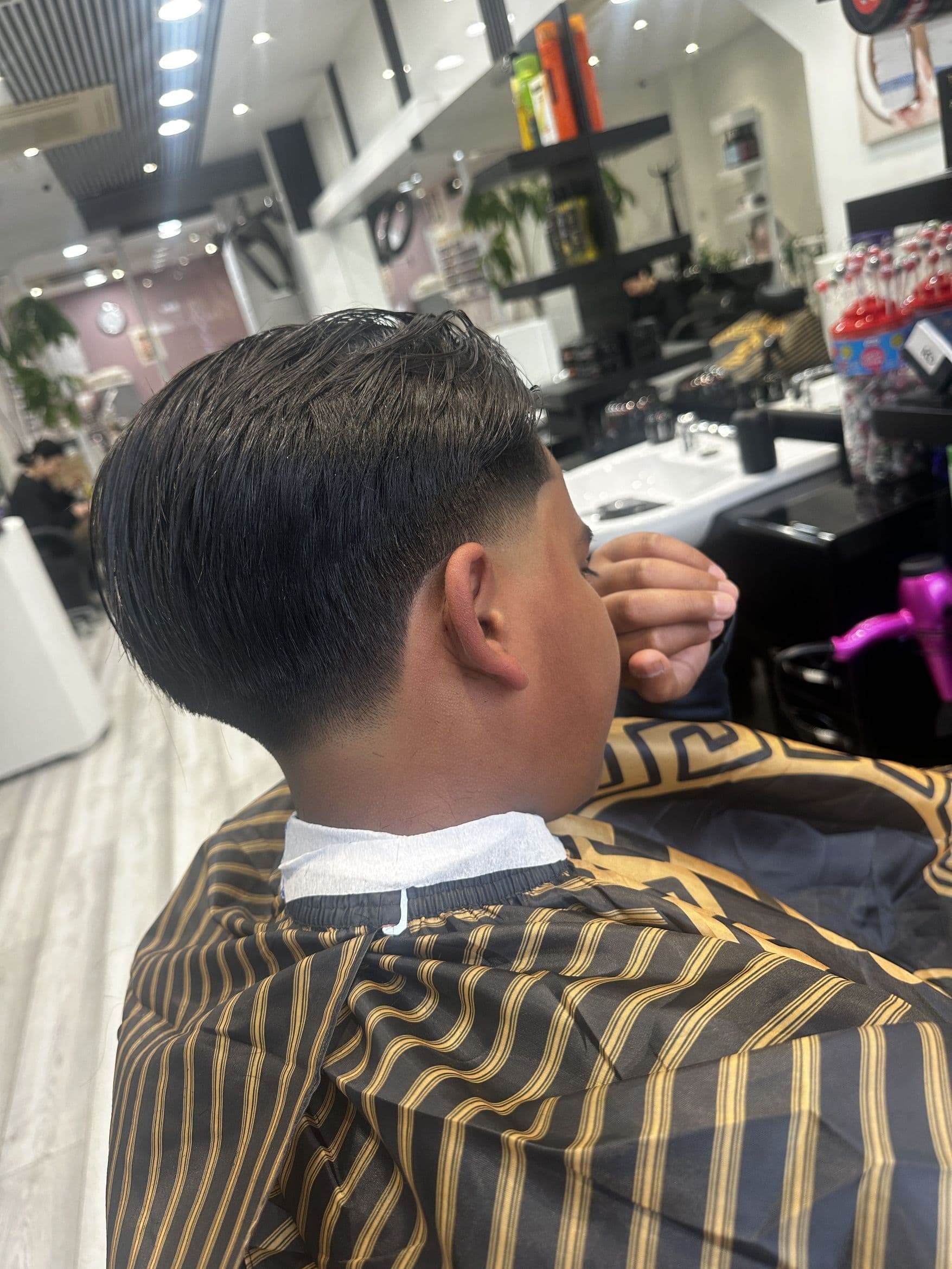 Low taper fade finished at KD Barbers